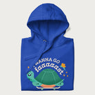 Folded royal blue hoodie with a graphic of a happy turtle on a skateboard and the text 'I Wanna Go Faaaaast'.