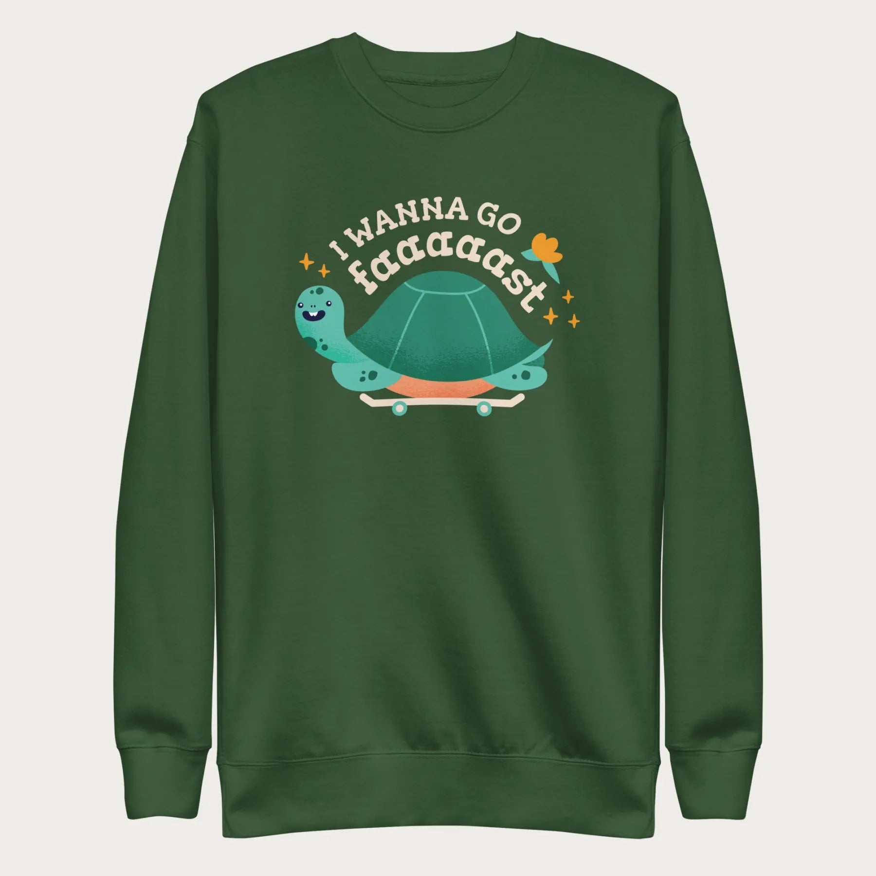 Forest green sweatshirt with a graphic of a turtle on a skateboard and the phrase 'I Wanna Go Fast.'