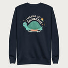 Navy blue sweatshirt with a graphic of a turtle on a skateboard and the phrase 'I Wanna Go Fast.'