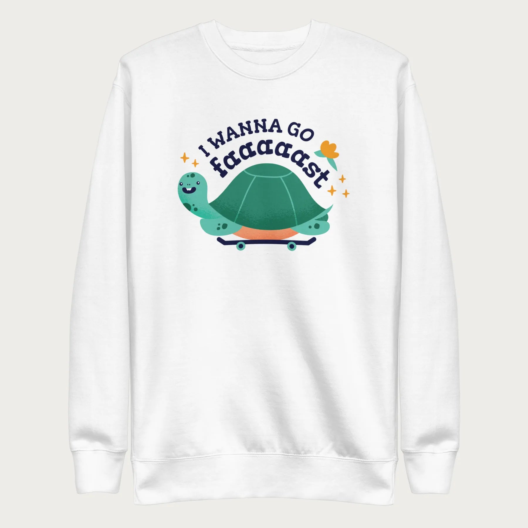 White sweatshirt with a graphic of a turtle on a skateboard and the phrase 'I Wanna Go Fast.'