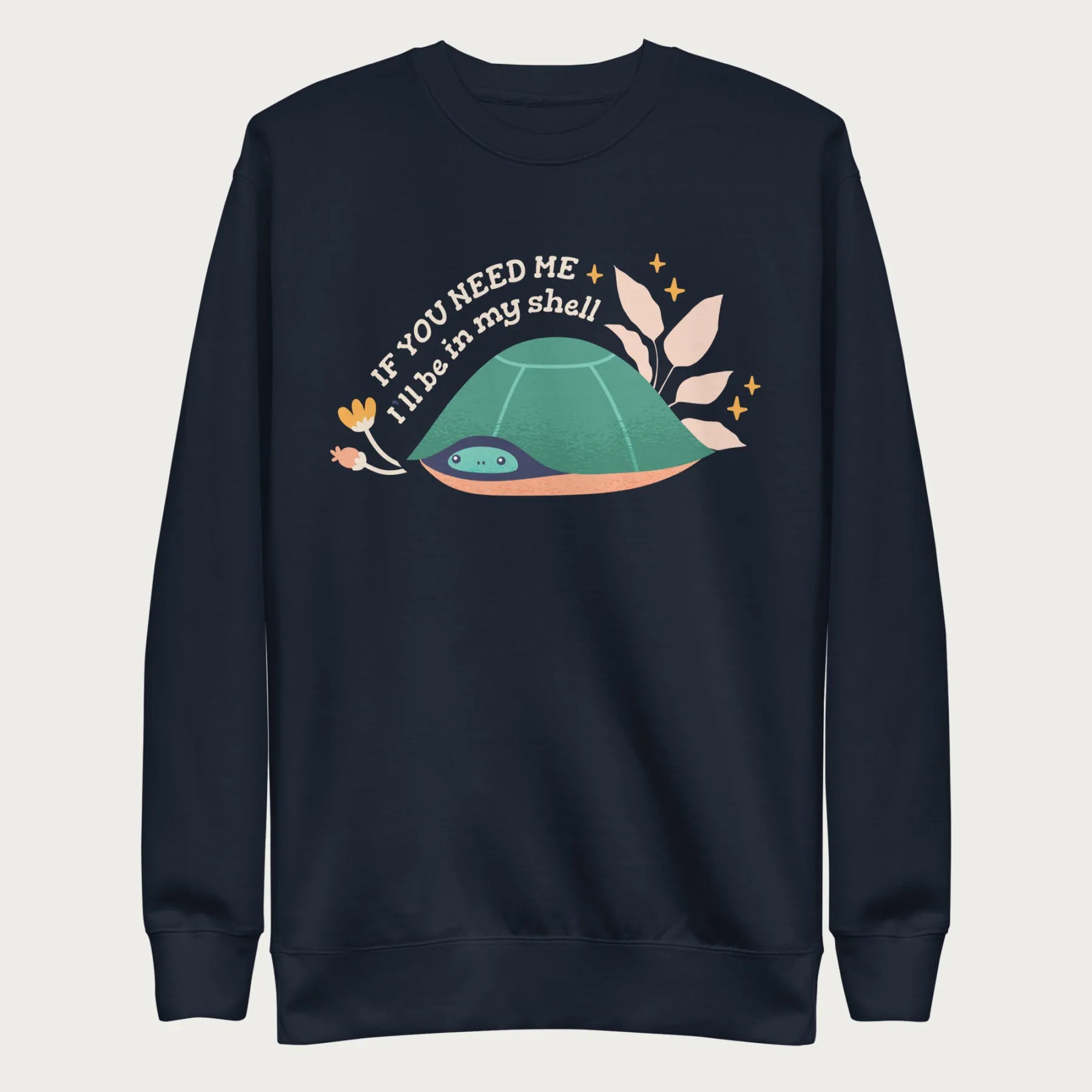 Navy blue sweatshirt with a graphic of a turtle hiding in its shell and the phrase 'If You Need Me, I'll Be in My Shell.'