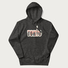 Dark grey hoodie with graphic of Tokyo's skyline integrated into the word 'TOKYO' in sunset colors.