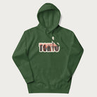 Forest green hoodie with graphic of Tokyo's skyline integrated into the word 'TOKYO' in sunset colors.