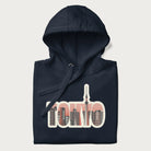 Folded navy blue hoodie with graphic of Tokyo's skyline integrated into the word 'TOKYO' in sunset colors.