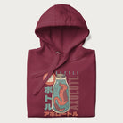 Folded maroon hoodie with Japanese graphic of a red axolotl in a bottle with Japanese text 'ボトル' (Bottle) and 'アホロートル' (Axolotl).