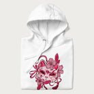Folded white hoodie with a Japanese kitsune mask and sakura design on the front.