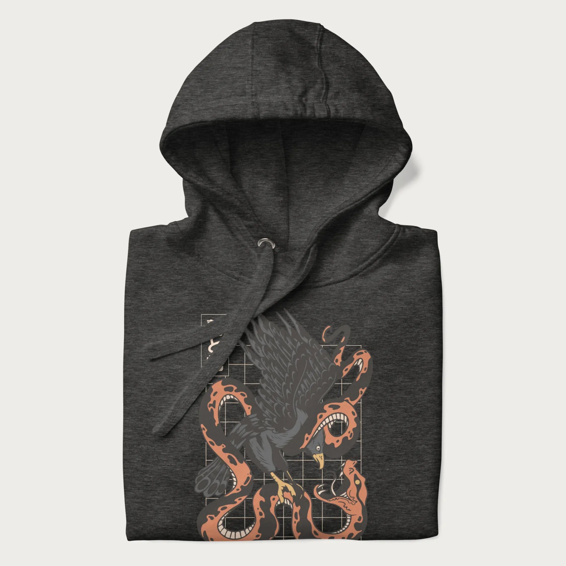 Folded dark grey hoodie with Japanese text and a graphic of an eagle battling a snake, with the text 'Tokyo Japan' underneath.