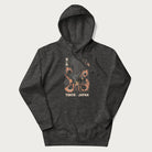 Dark grey hoodie with Japanese text and a graphic of an eagle battling a snake, with the text 'Tokyo Japan' underneath.