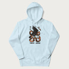 Light blue hoodie with Japanese text and a graphic of an eagle battling a snake, with the text 'Tokyo Japan' underneath.