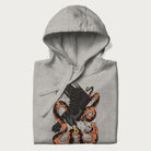 Folded light grey hoodie with Japanese text and a graphic of an eagle battling a snake, with the text 'Tokyo Japan' underneath.