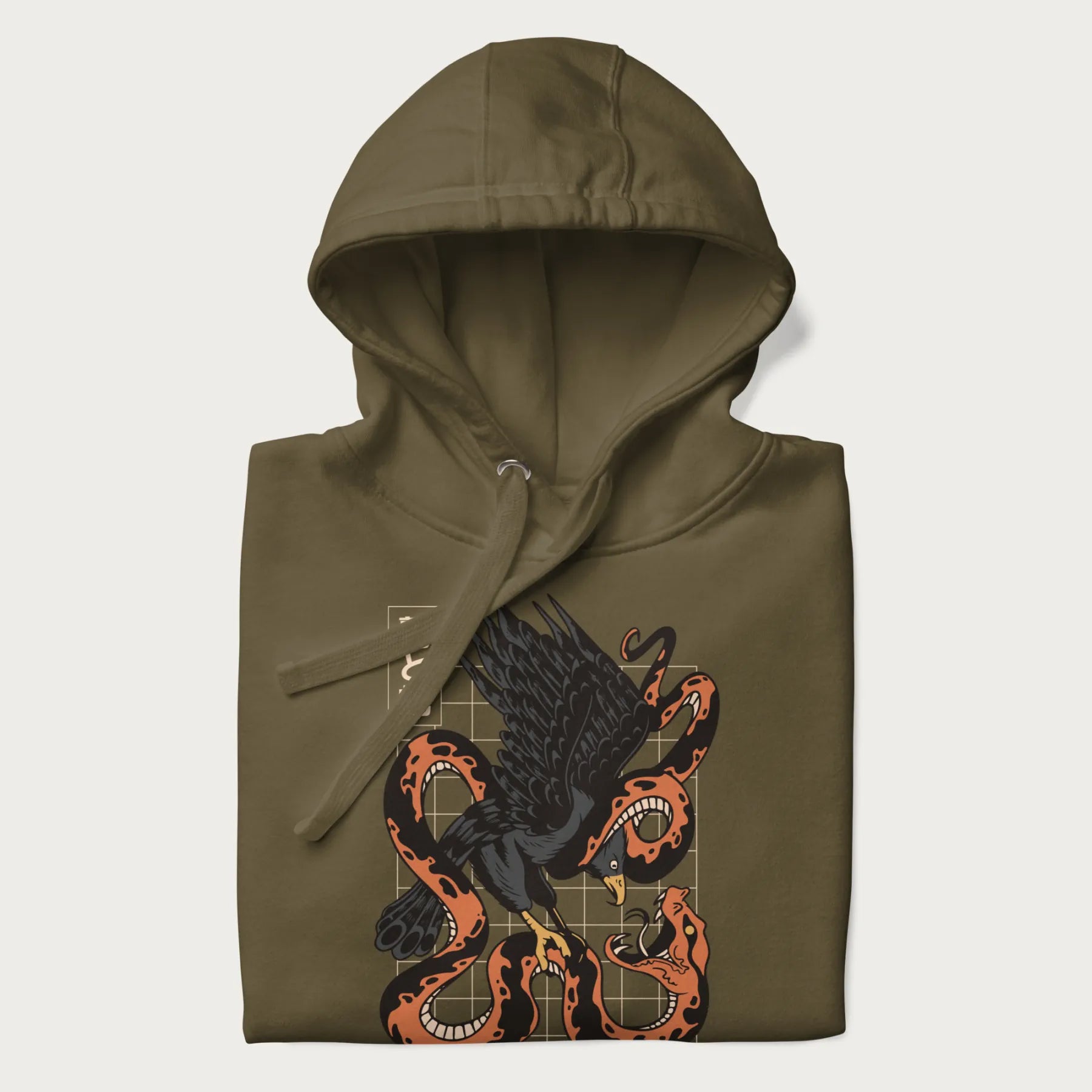 Folded military green hoodie with Japanese text and a graphic of an eagle battling a snake, with the text 'Tokyo Japan' underneath.