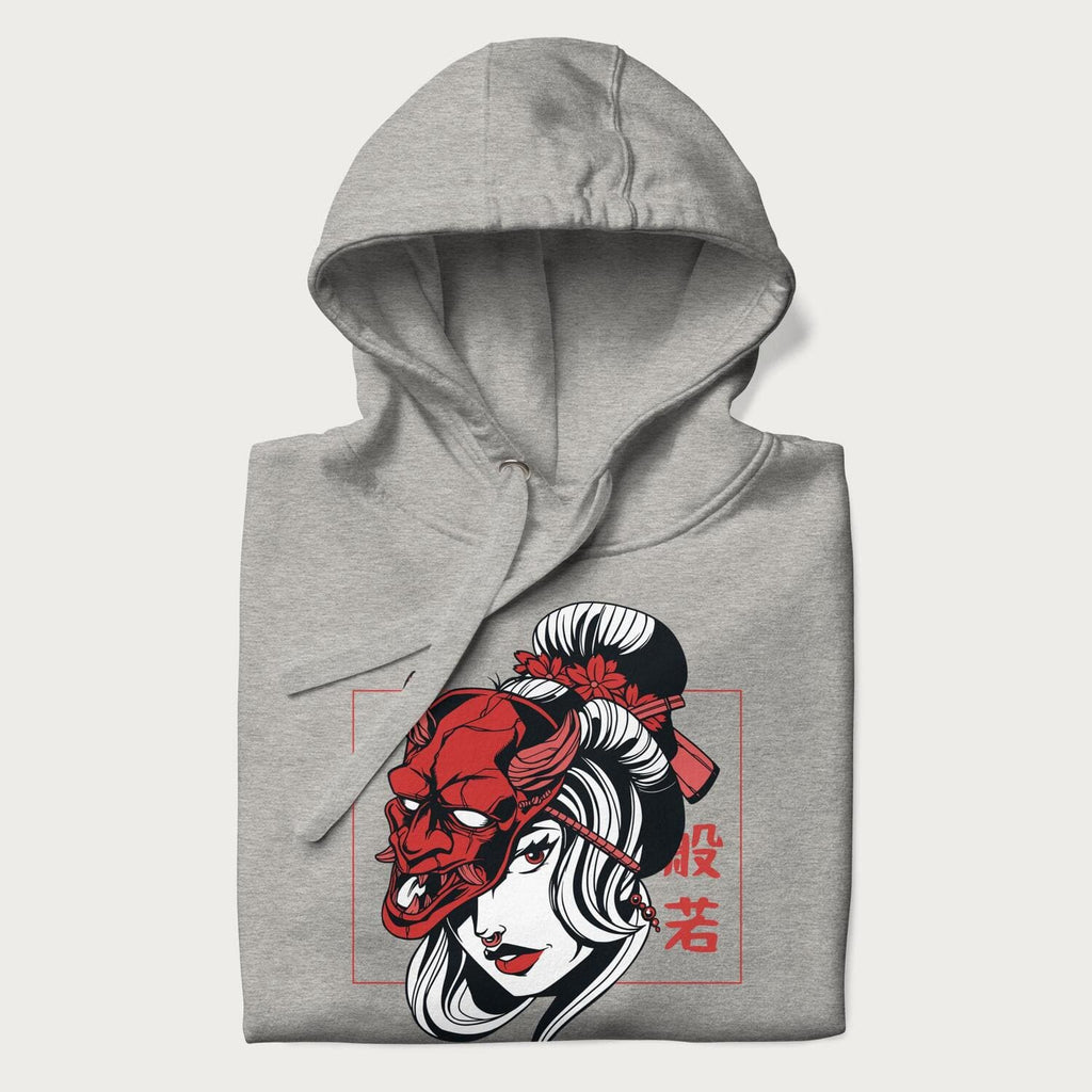 Folded light grey hoodie with a japanese geisha and hannya mask graphic.