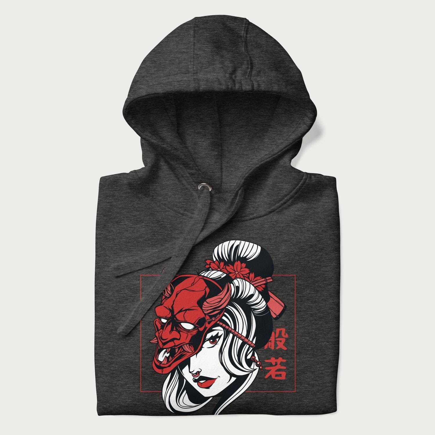 Folded dark grey hoodie with a japanese geisha and hannya mask graphic.