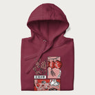 Folded maroon hoodie with a Japanese cherry blossom festival design.
