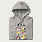 Folded light grey hoodie with a cute Japanese Sushi Cat design.