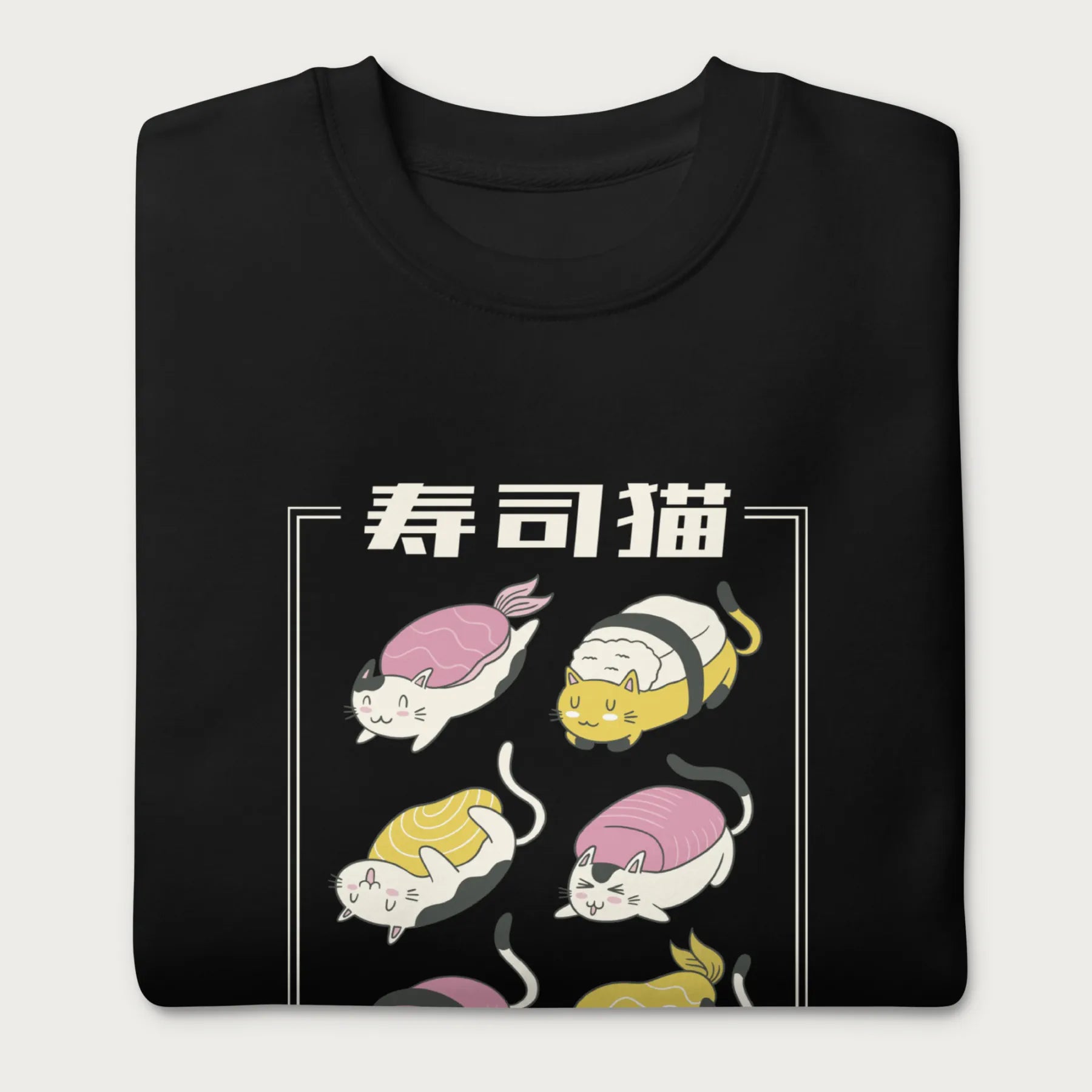 Folded black sweatshirt with Japanese text and graphic of cats disguised as sushi.