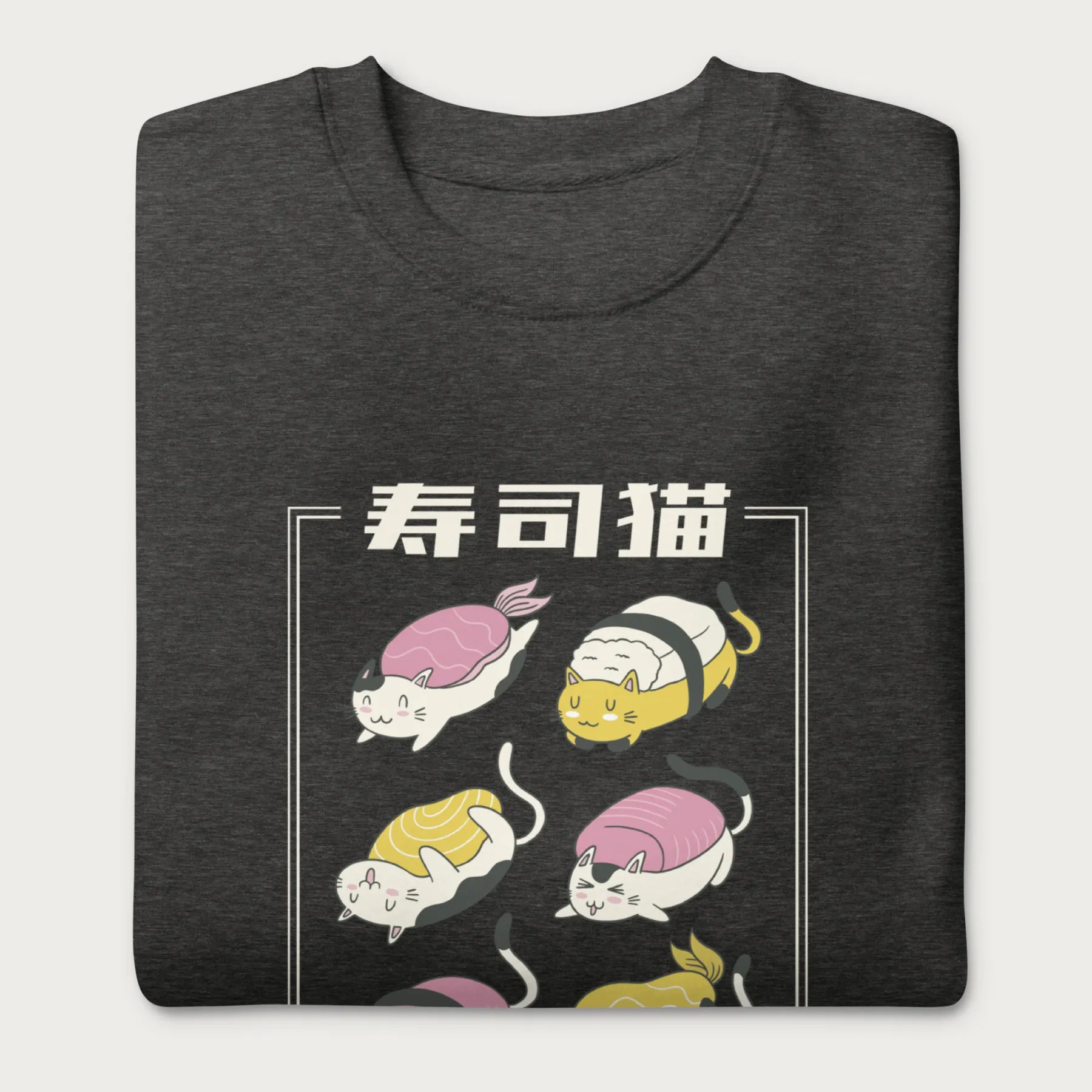 Folded dark grey sweatshirt with Japanese text and graphic of cats disguised as sushi.