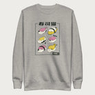 Light grey sweatshirt with Japanese text and graphic of cats disguised as sushi.