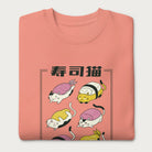 Folded light pink sweatshirt with Japanese text and graphic of cats disguised as sushi.