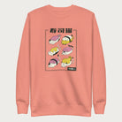 Light pink sweatshirt with Japanese text and graphic of cats disguised as sushi.