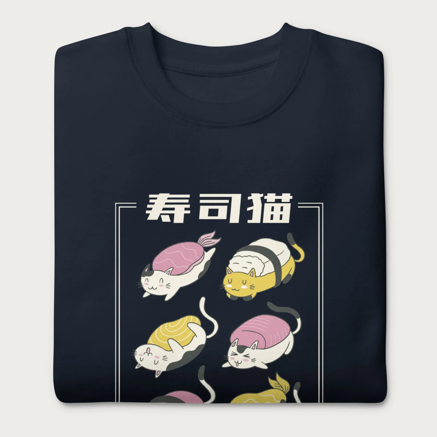 Folded navy blue sweatshirt with Japanese text and graphic of cats disguised as sushi.