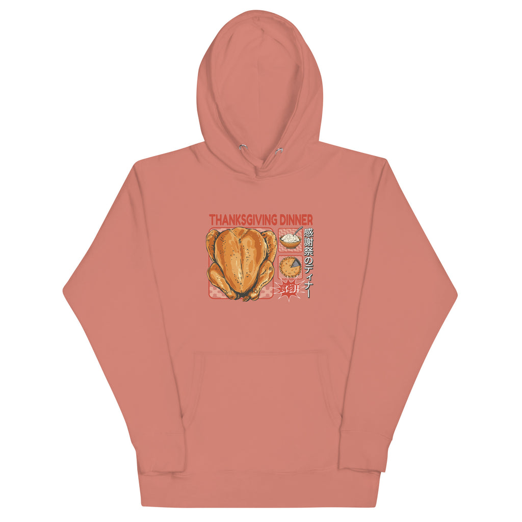 Front of Japanese Thanksgiving Hoodie in Dusty Rose: A soft, muted pinkish-red hoodie with a finely detailed graphic on the front, showcasing a Japanese Thanksgiving feast with a roast chicken, Japanese potato salad, and an apple pie.