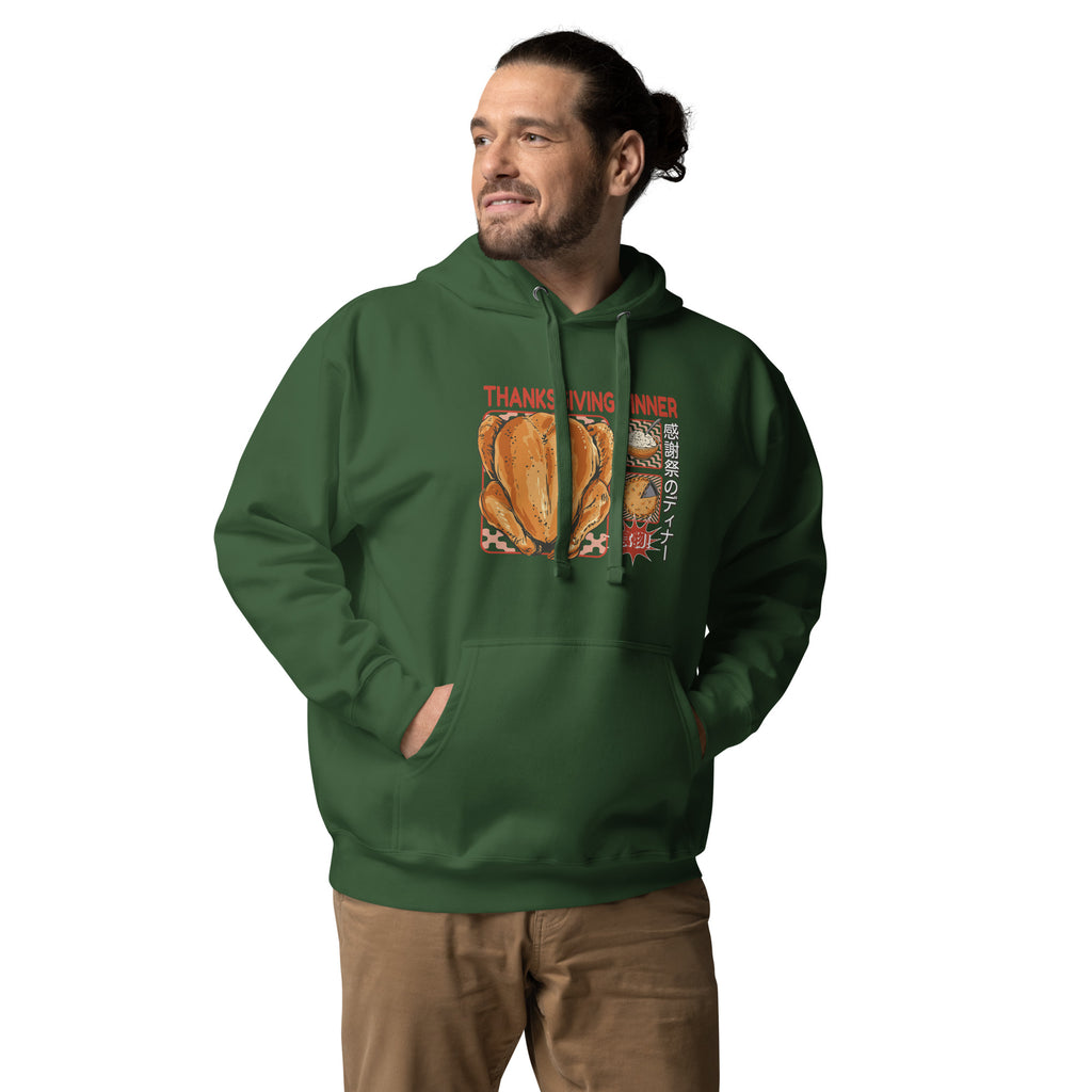 Man wearing a Japanese Thanksgiving hoodie in Forest Green colorway, featuring a graphic print of a roast chicken, Japanese potato salad, and an apple pie.