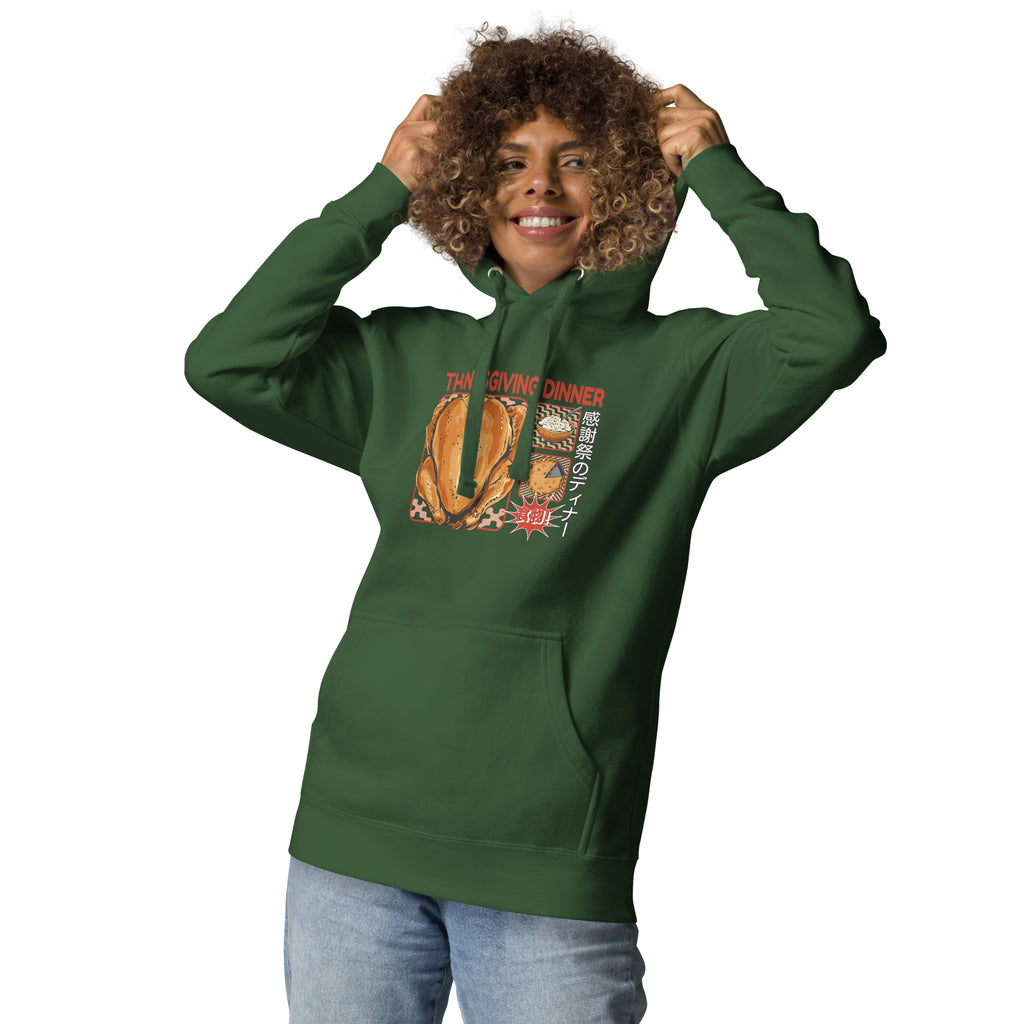 Woman wearing a Japanese Thanksgiving hoodie in Forest Green colorway featuring a graphic print of roast chicken, Japanese potato salad, and an apple pie.