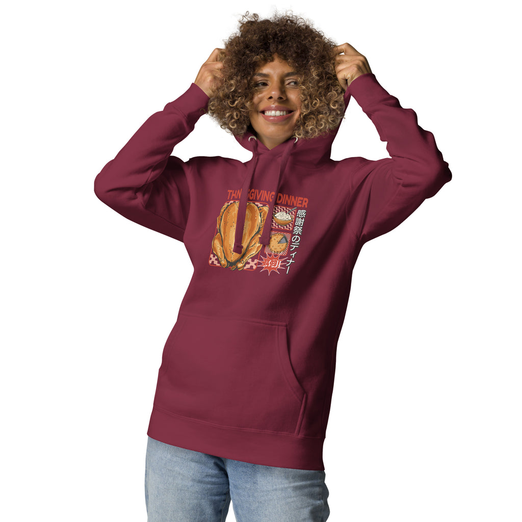Woman wearing a Japanese Thanksgiving hoodie in Maroon colorway featuring a graphic print of roast chicken, Japanese potato salad, and an apple pie.