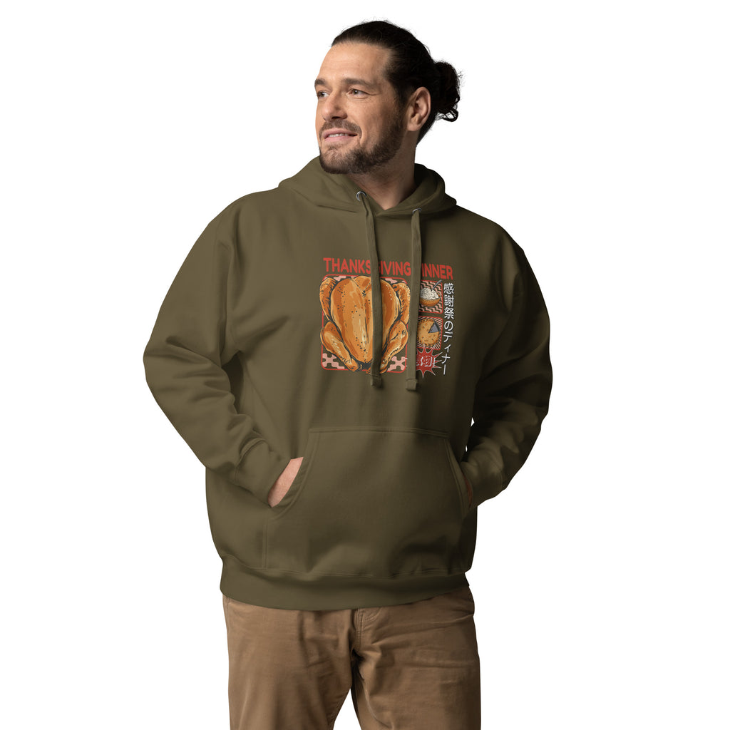 Man wearing a Japanese Thanksgiving hoodie in Military Green colorway, featuring a graphic print of a roast chicken, Japanese potato salad, and an apple pie.