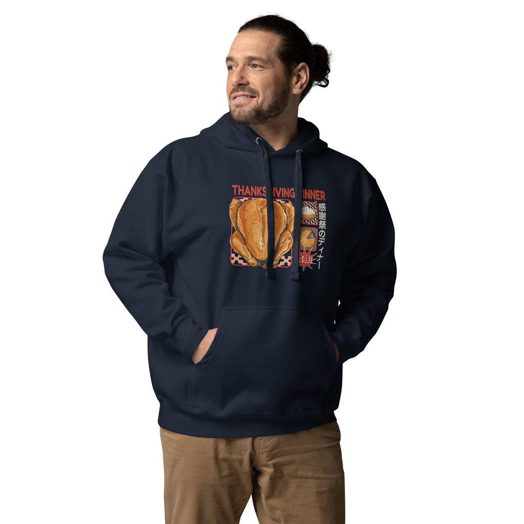Man wearing a Japanese Thanksgiving hoodie in Navy Blazer colorway, featuring a graphic print of a roast chicken, Japanese potato salad, and an apple pie.