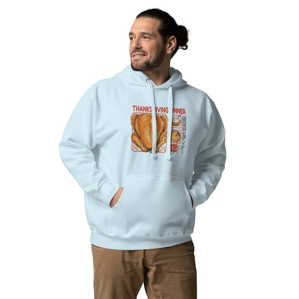 Man wearing a Japanese Thanksgiving hoodie in Sky Blue colorway, featuring a graphic print of a roast chicken, Japanese potato salad, and an apple pie.