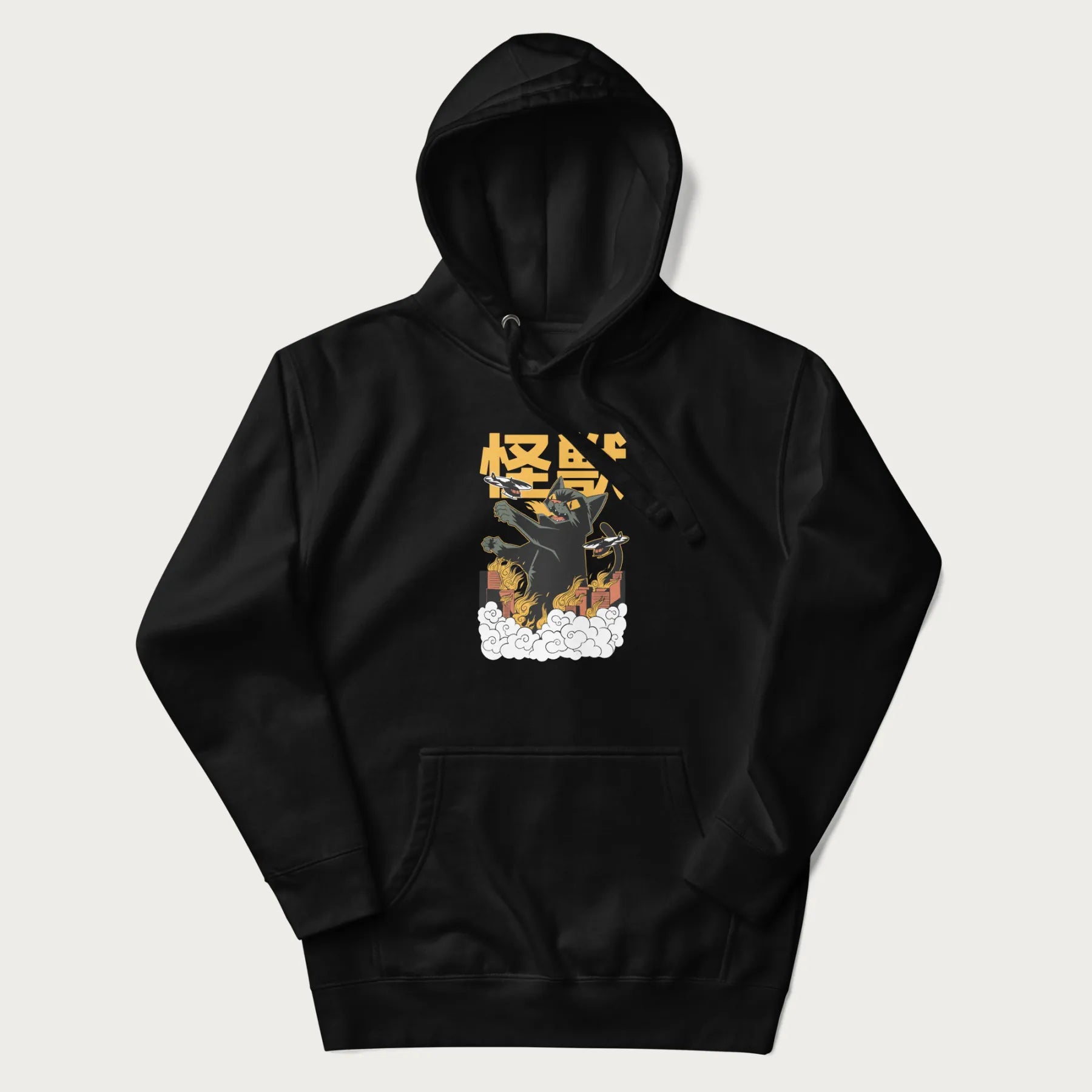 Black hoodie with graphic of a 'Kaiju Cat' with helicopters and flames in a burning city.