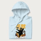 Folded light blue hoodie with graphic of a 'Kaiju Cat' with helicopters and flames in a burning city.