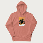 Light pink hoodie with graphic of a 'Kaiju Cat' with helicopters and flames in a burning city.