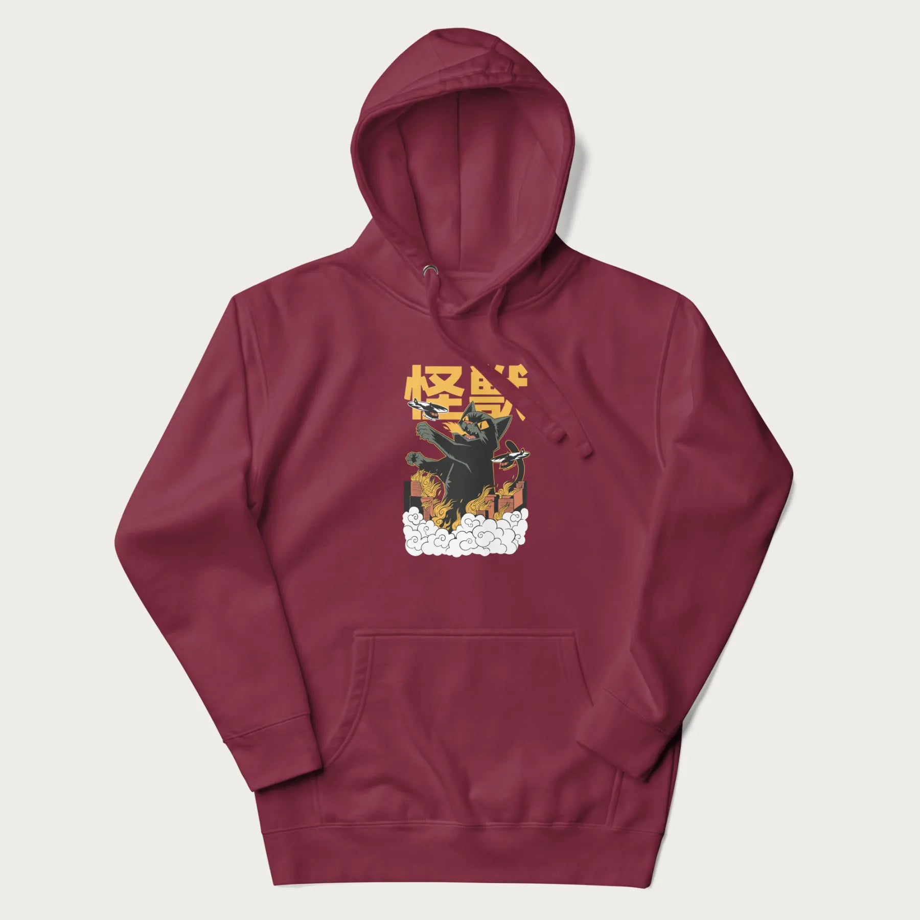 Maroon hoodie with graphic of a 'Kaiju Cat' with helicopters and flames in a burning city.