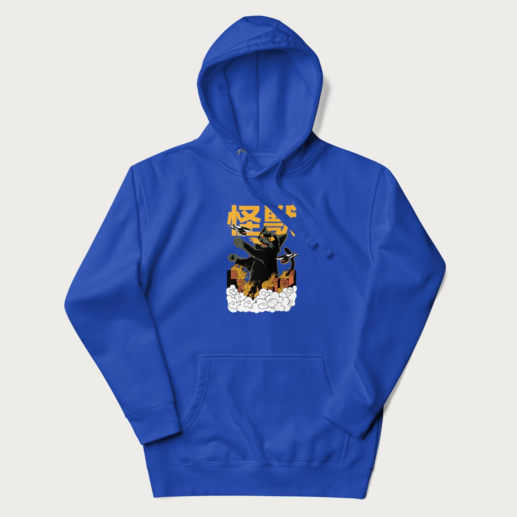 Royal blue hoodie with graphic of a 'Kaiju Cat' with helicopters and flames in a burning city.