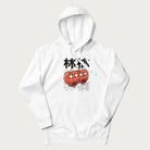 White hoodie with Japanese graphic of two cute apples with kawaii faces, surrounded by the Japanese text '林檎' (Apple)