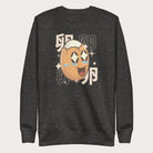 Dark grey sweatshirt with Japanese text and a kawaii boiled egg graphic with sparkling eyes..