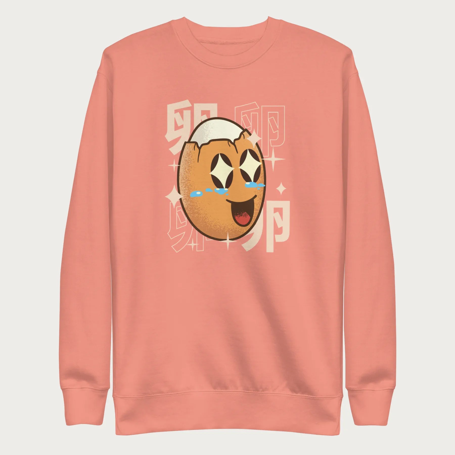 Light pink sweatshirt with Japanese text and a kawaii boiled egg graphic with sparkling eyes..