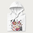Folded white hoodie with Japanese graphic of a cat eating ramen with Japanese text '猫' in the background.