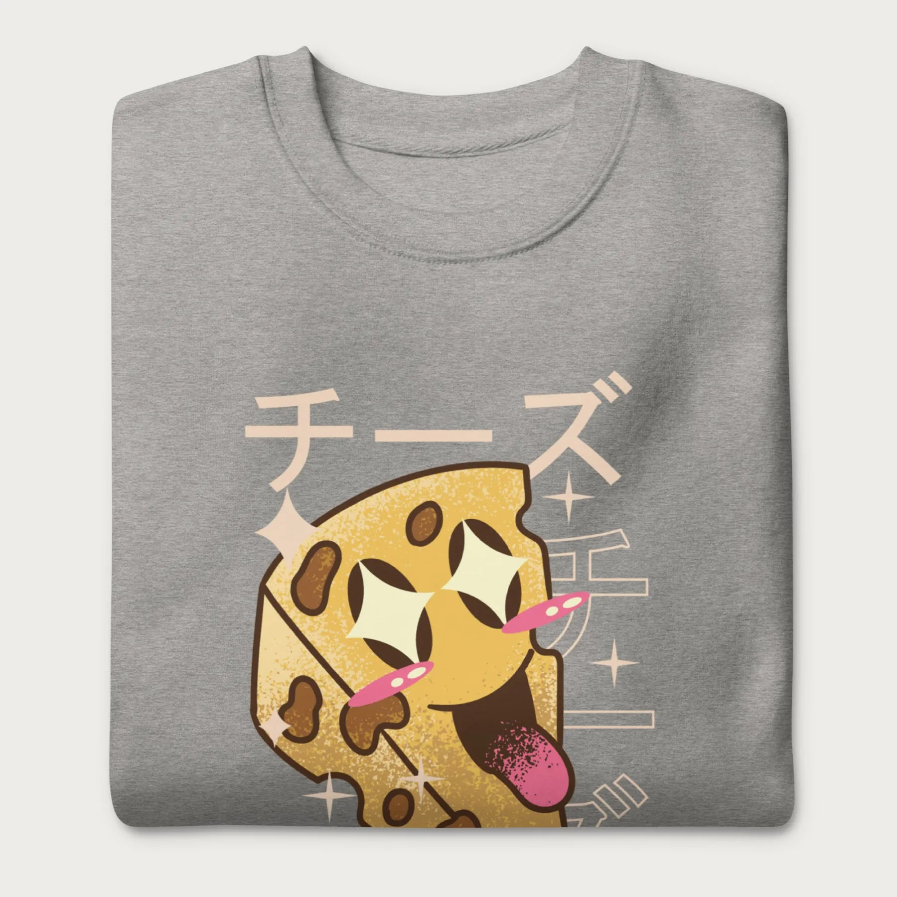 Folded light grey sweatshirt with Japanese text and a kawaii cheese wedge graphic.