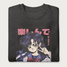 Folded dark grey sweatshirt with a vibrant graphic of an anime girl flashing a peace sign with bold Japanese text.