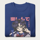 Folded royal blue sweatshirt with a vibrant graphic of an anime girl flashing a peace sign with bold Japanese text.