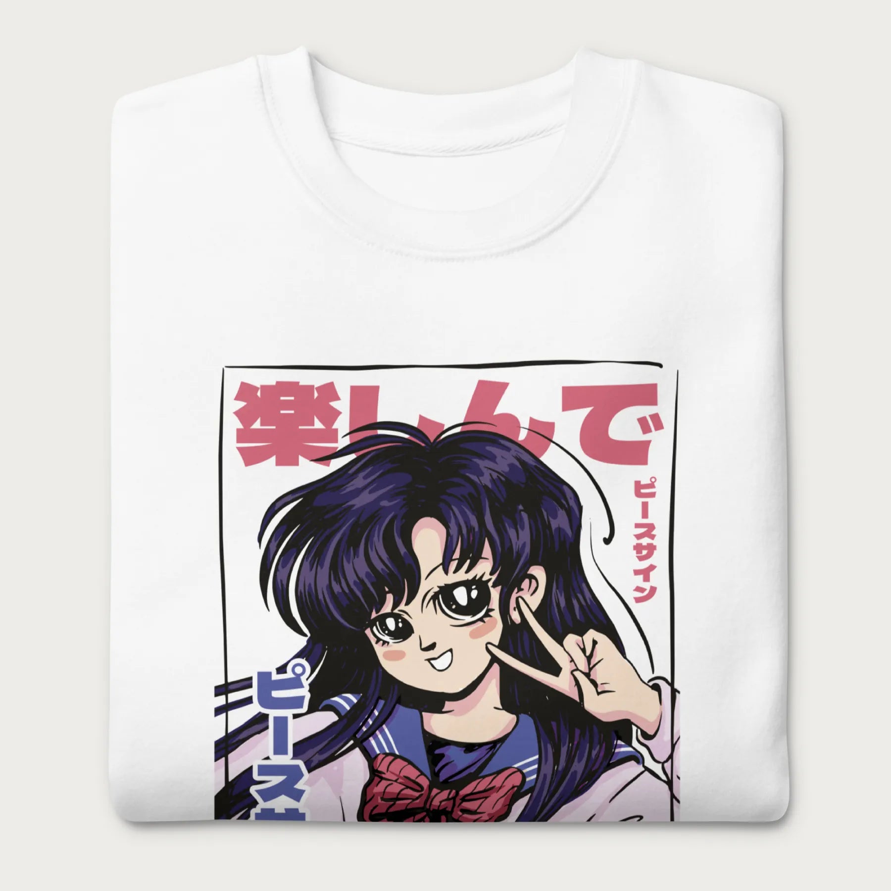 Folded white sweatshirt with a vibrant graphic of an anime girl flashing a peace sign with bold Japanese text.