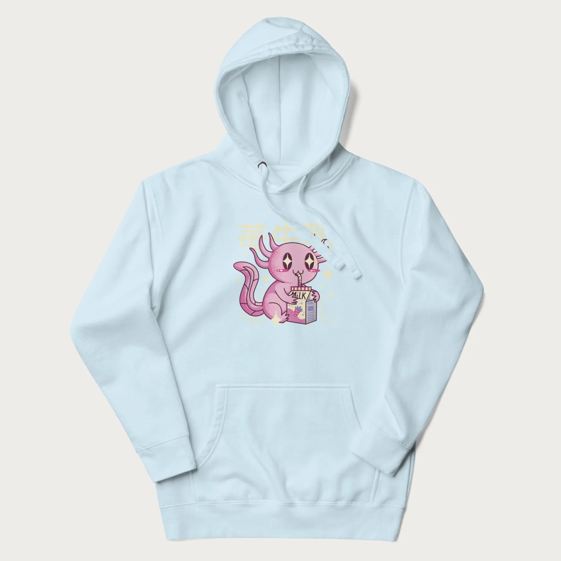 Light blue hoodie with Japanese graphic of a cute pink axolotl sipping strawberry milk from a carton, with Japanese text '苺牛乳' (Strawberry Milk).