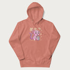 Light pink hoodie with Japanese graphic of a cute pink axolotl sipping strawberry milk from a carton, with Japanese text '苺牛乳' (Strawberry Milk).