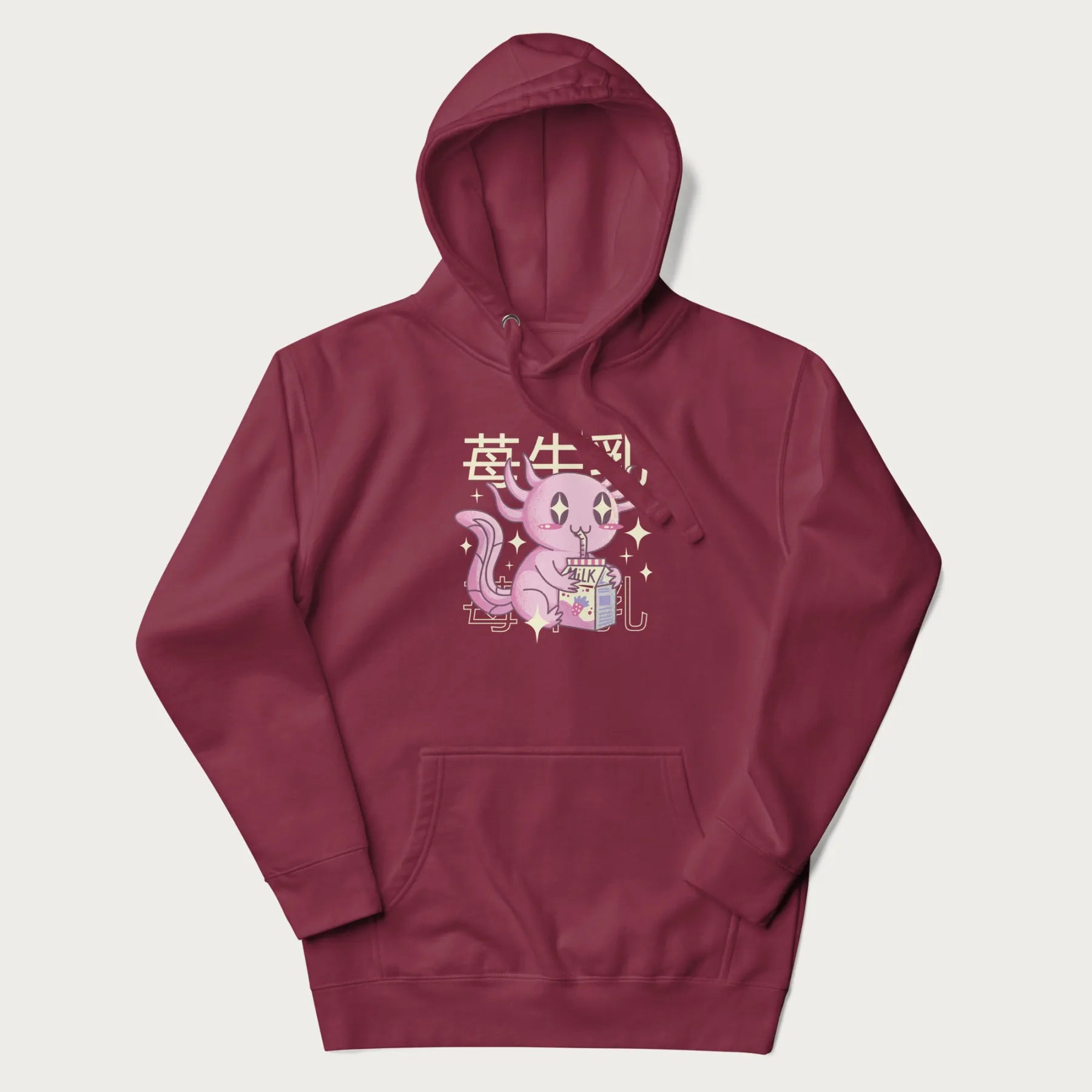 Maroon hoodie with Japanese graphic of a cute pink axolotl sipping strawberry milk from a carton, with Japanese text '苺牛乳' (Strawberry Milk).