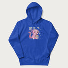 Royal blue hoodie with Japanese graphic of a cute pink axolotl sipping strawberry milk from a carton, with Japanese text '苺牛乳' (Strawberry Milk).