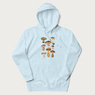 Light blue hoodie with Japanese graphic of cute and expressive mushrooms with various faces.